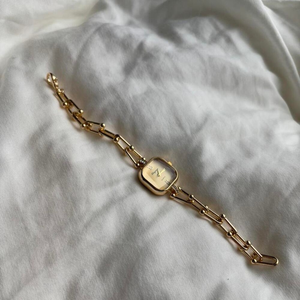 Gold watch with diamond accents - Picture 2 of 2